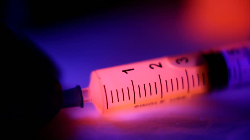 Pink fluid in Syringe
