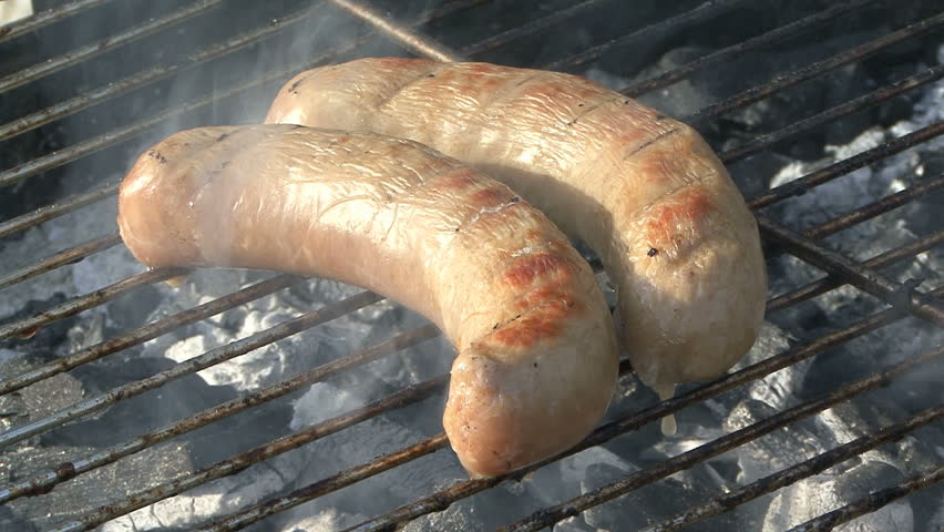 grilling sausages on a BBQ
