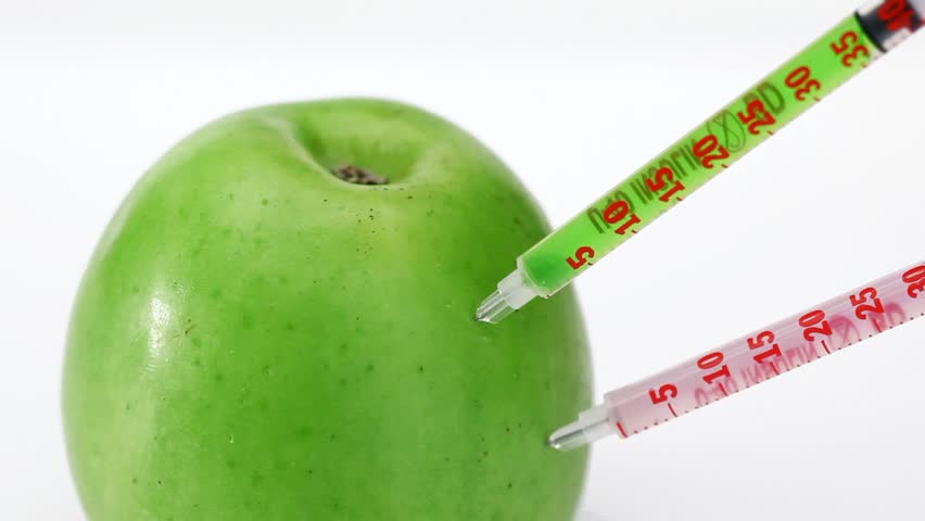 GMO apple injection with three syringe on the white background  