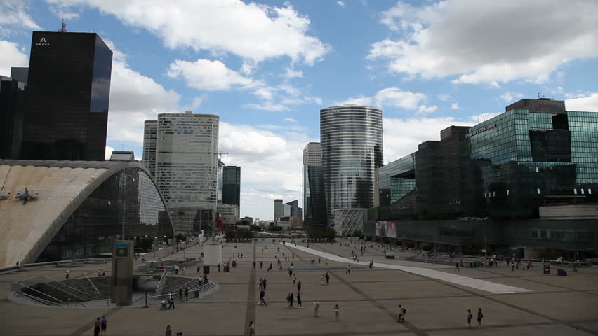 PARIS - AUGUST 7: Tourists and locals walk in La Defense August 7, 2010  in Paris. La Defense is a major business district in the metropolitan area of Paris, France.