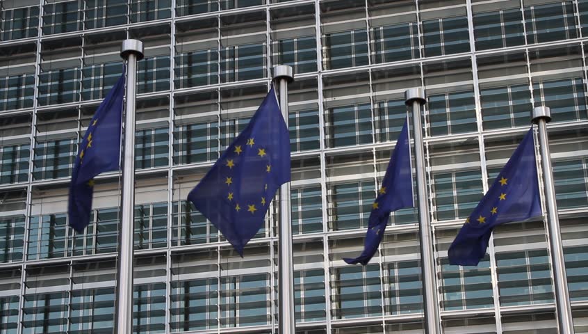 European Flags floating in front of the European Commission building in Brussels