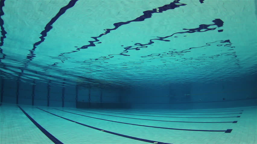 Olympic Swimming Pool Underwater empty olympic swimming pool underwater with surface ripples stock Olympic Swimming Pool Underwater empty olympic swimming pool underwater with surface ripples stock