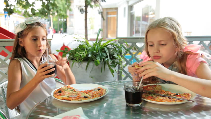 Little Girl Eating Pizza In Restaurant Stock Footage Video 2494331