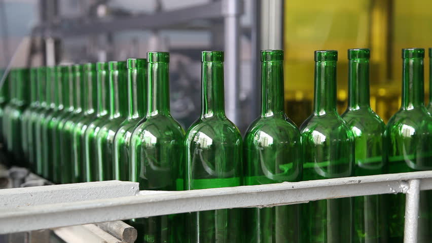 Conveyor and green glass bottles