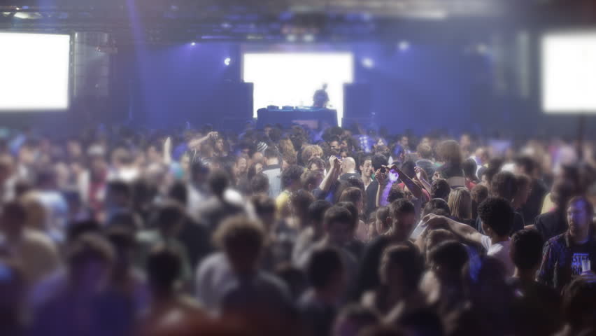 middle shot of dj and people dancing 3 screens