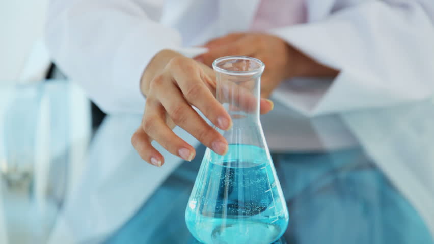 Female Researcher Holding a Flask