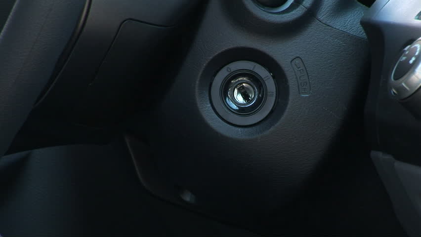 Close up of man starting ignition to car