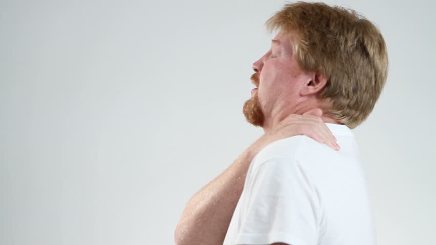 Man rubs and massages his shoulder to relieve the pain.