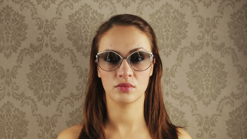 stop-motion of a pretty woman wearing different retro sunglasses