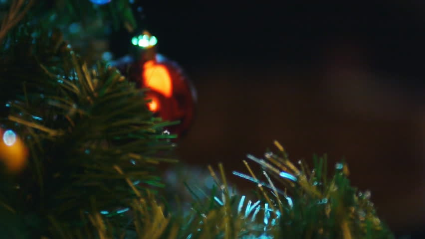 Christmas tree, lighting candles, cookies,  rack focus 
