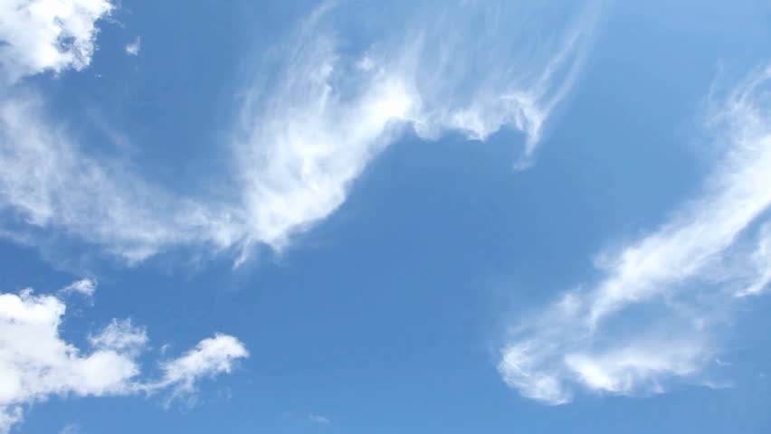 Time lapse clip of white clouds over blue sky