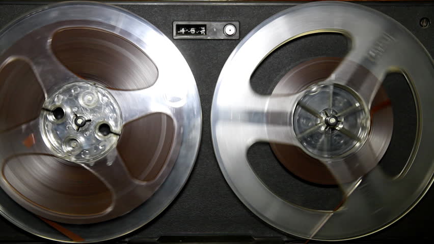 Old retro Reel Audio Recorder reels spinning
