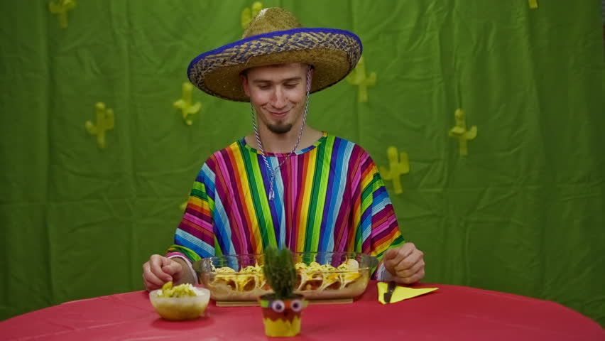 Woman With Sombrero Eating Tortilla Chips Woman In Mexican Clothes And