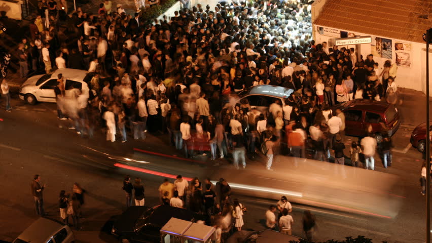 MARSEILLE - JULY 09: a large crowd waits to get into a nightclub, Marseille, France. JULY 09, 2008. (Time Lapse)