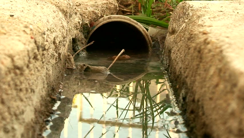 Water flowing down a storm drain 