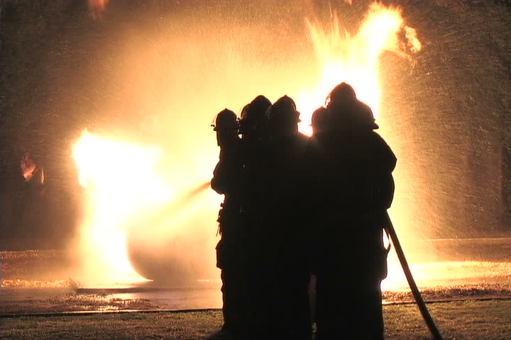 Firefighters battle a liquid propane tank fire