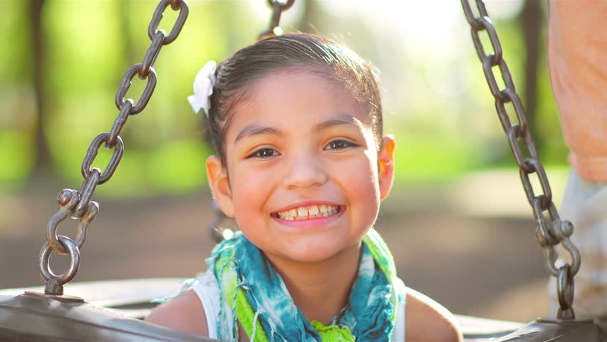 Adorable Little Girl Swings On Her Belly. Medium Shot. Stock Footage ...