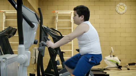 Fat Little Boy Workout Exercise Bike Stock Footage Video (100% Royalty-free) 1009243616 | Shutterstock