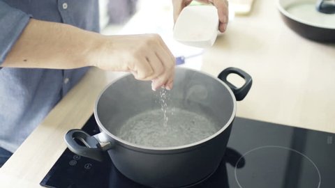 boiling salt water in a pot