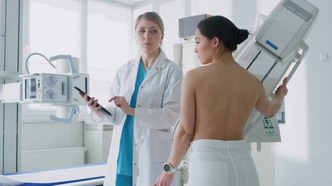 480px x 270px - In the hospital, female patient listens to mammography technologist /  doctor uses tablet computer, explains importance of breast cancer  prevention. mammography procedure. shot on red epic-w 8k camera
