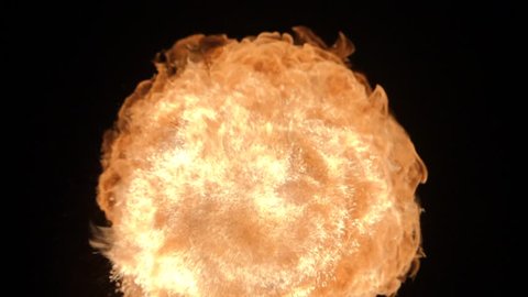 Fire ball explosion, high speed camera, isolated fire flame on black background, slow motion.