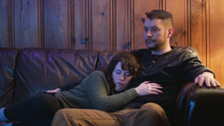 4k00 12a Young Couple Kiss As They Cuddle And Snuggle At Night On