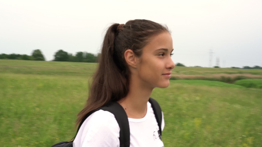 Hd00 14smiling Lady With Long Hair In Ponytail Wanders On Lush