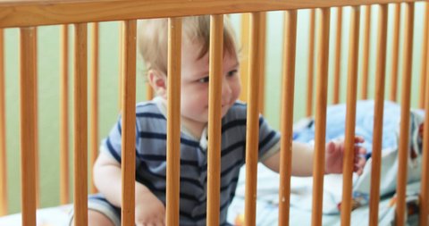 Kid In The Crib Looks Stock Footage Video 100 Royalty Free