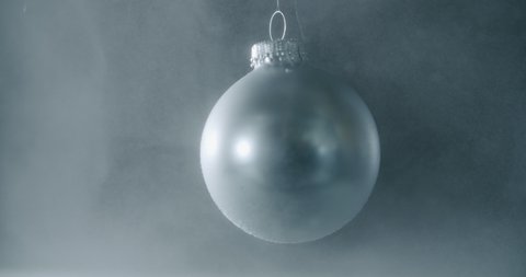 Christmas Bulb Swings Slowly Against Stock Footage Video