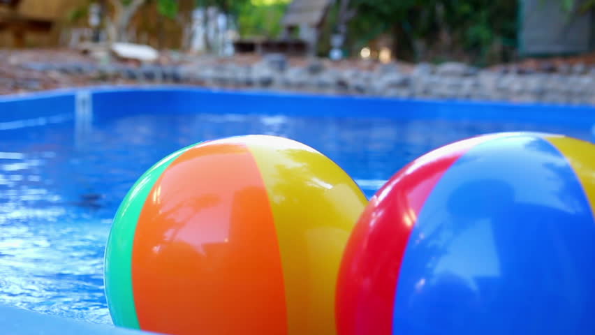 Pool Water With Beach Ball colorful beach ball thrown into the water in the pool stock Pool Water With Beach Ball colorful beach ball thrown into the water in the pool stock