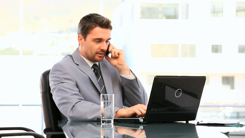 Businessman Having A Phone Call At His Desk Stock Footage Video Dark Haired Businessman Working At His Desk Hd Stock Footage Clip