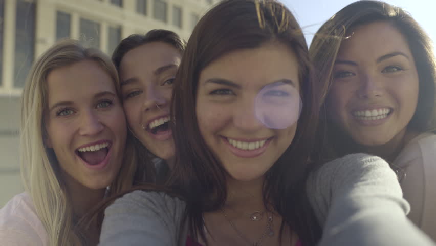 Closeup Of Carefree Teen Girls Making Funny Faces And Smiling For Selfies (4K)
