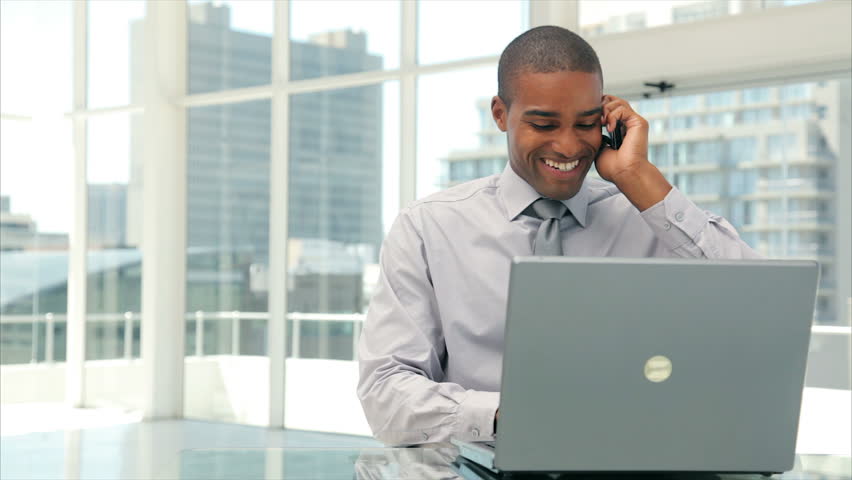 Panning Shot of Businessman Answering Stockvideos & Filmmaterial