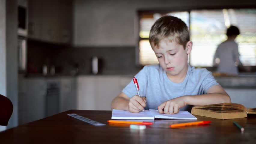 Image result for student at dinner table doing homework