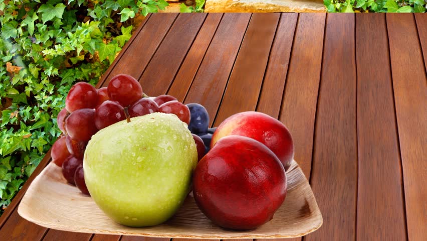 Kitchen Table Close Up closeup of bunch of wet tomatoes and fresh lemons on wooden Kitchen Table Close Up closeup of bunch of wet tomatoes and fresh lemons on wooden
