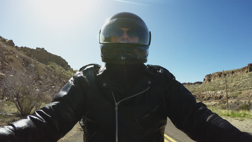 A Low Angle Shot Of Motorcycle Rider In Winter Riding Coat And Close Up Shot Of A Biker Motorcyclists Wearing Helmet And Leather Jacket Motorcyclist