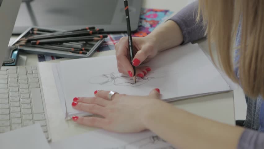 Wuhan China 27 September 2017 Hand Of A Young Chinese Women Designer Draws A Model Clothes Hd Stock Footage Clip