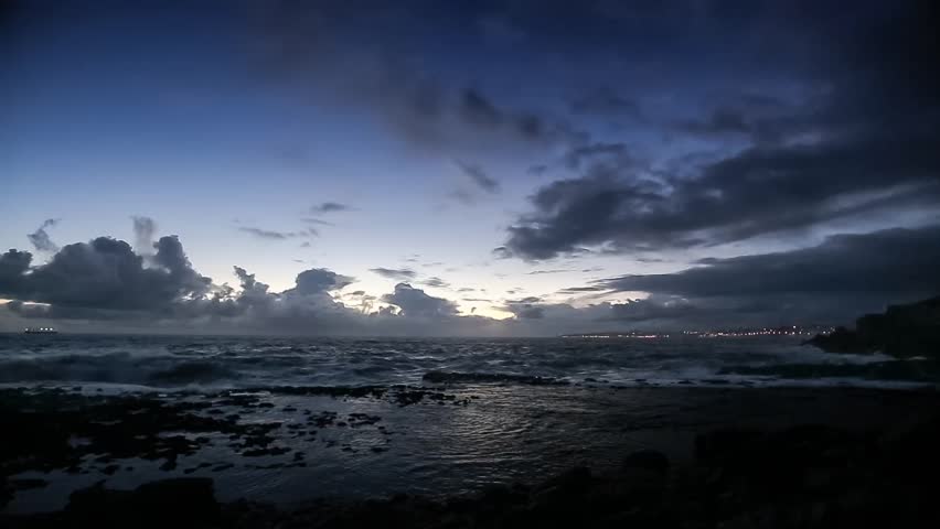 Stock video of cinemagraph loop -rocky beach at night | 12529466