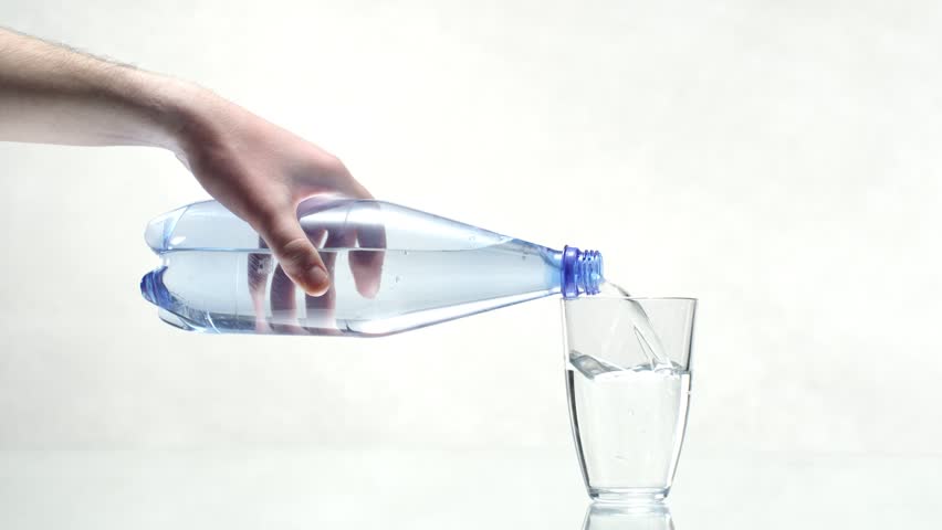 Bottle Of Water Pouring Into A Glass, Slow Motion Stock Footage Video ...