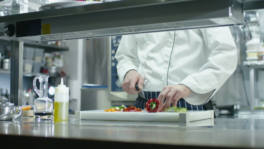 Restaurant Kitchen Video professional chef in a commercial kitchen in a restaurant or hotel Restaurant Kitchen Video professional chef in a commercial kitchen in a restaurant or hotel