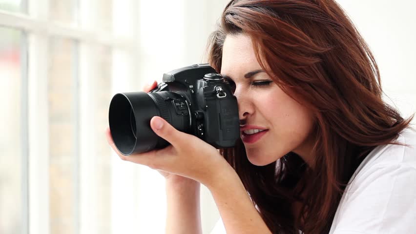 Beautiful Young Female Photographer  Taking Pictures Puts 
