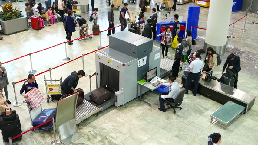 Macau February 24 2015 Unidentified Passengers Put Bags And Suitcases On Security Scanner Macau February 24 2015 Unidentified Passengers Put Bags And Suitcases On Security Scanner