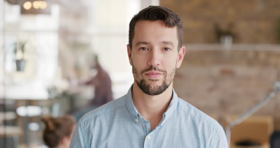 Portrait of successful Businessman entrepreneur working at busy office smiling