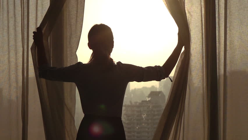 Woman  unveil curtains in room in the morning, 240fps

