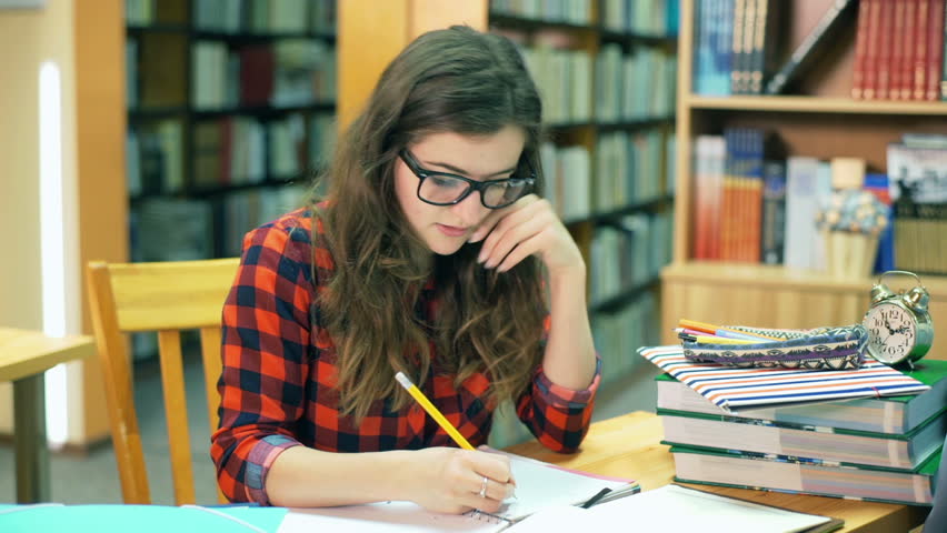 Image result for IMAGE OF SOMEONE STUDYING IN THE LIBRARY