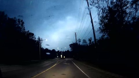 Waterloo, Ontario, Canada May 2016 POV dashcam driving on dark rainy night in lightning storm