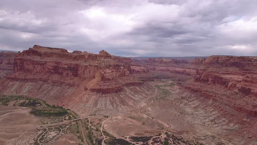 Jagged Red Rock Cliffs Against Ocean Background Filmati e video d ...