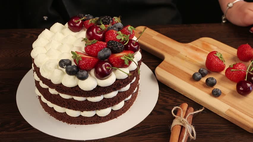 Female Hands Decorating Chocolate Cake Stock Footage Video 100