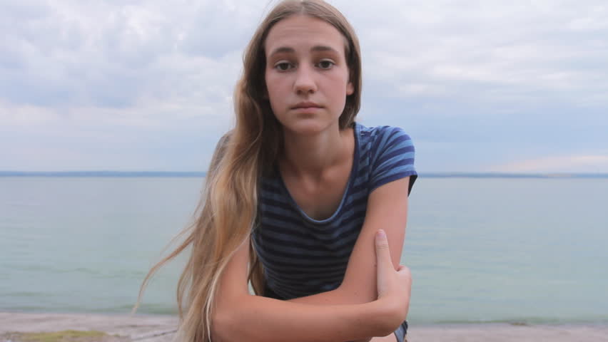 Alone Beach Girl Sea Sad Teen Lonely And Sadness Sitting On Sad Pensive Teenage Girl Sea Beach Portrait Of Blonde Young Woman Looking At Camera