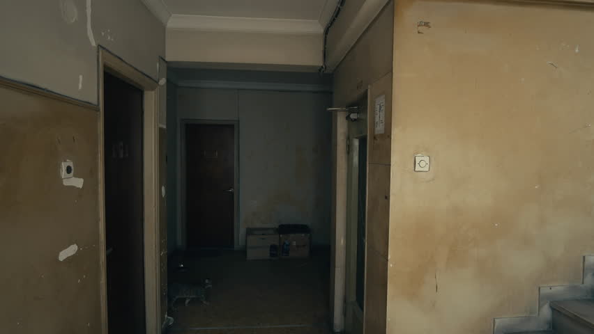 Apartment Building Hall floor entrance of an old ghetto apartment building.tracking shot Apartment Building Hall floor entrance of an old ghetto apartment building.tracking shot